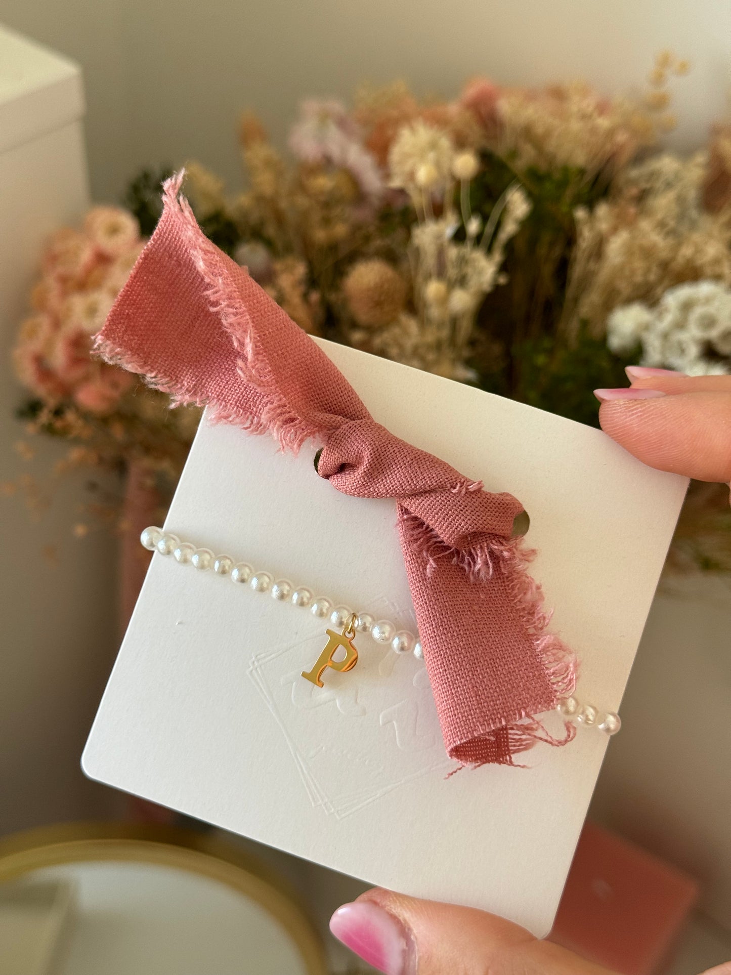 Pulsera clásica lazada rosa maquillaje