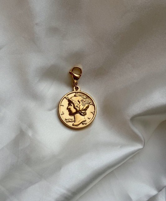 Charms moneda